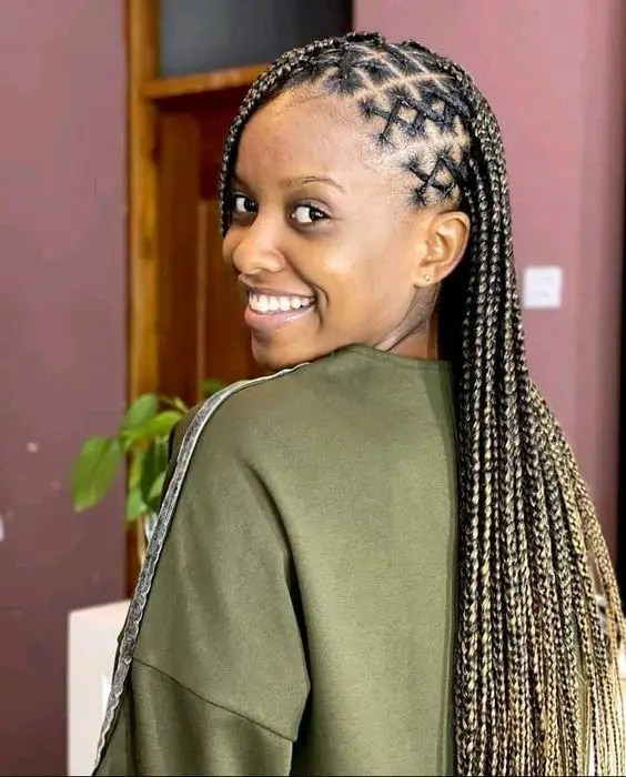 Smiling woman showing the side of her tribal braid