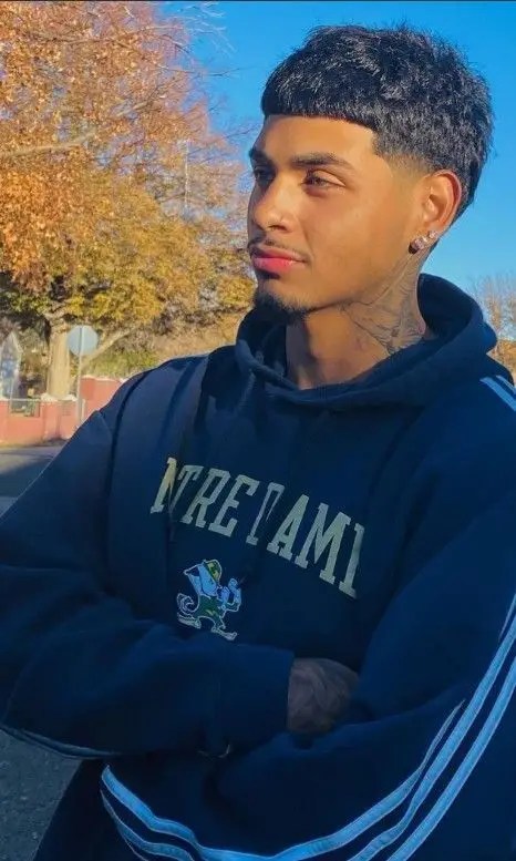 Cute guy rocking a fluffy hairstyle
