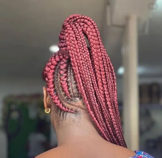 Woman in high ponytail ghana weave style