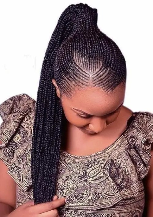 Fair lady rocking tiny Ghanaian braids in ponytail