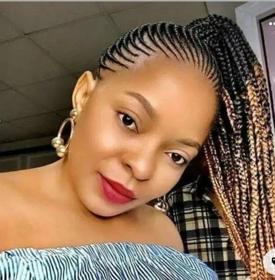 Beautiful woman wearing tiny ghana weave style in pop colors