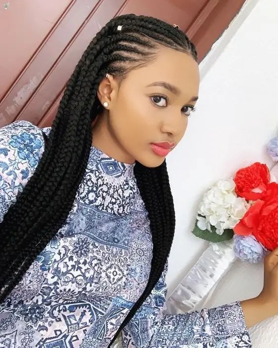 Woman rocking Ghanaian braids with long extensions