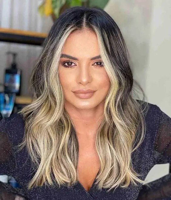 Woman rocking blonde highlights in her hair