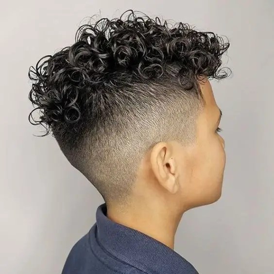 Man rocking curly Edgar hairstyle