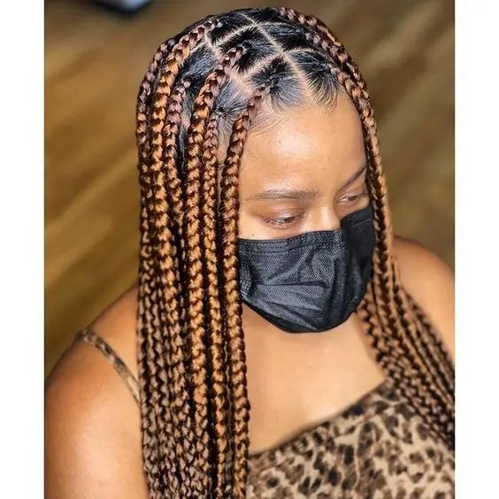Woman with face mac wearing box braid