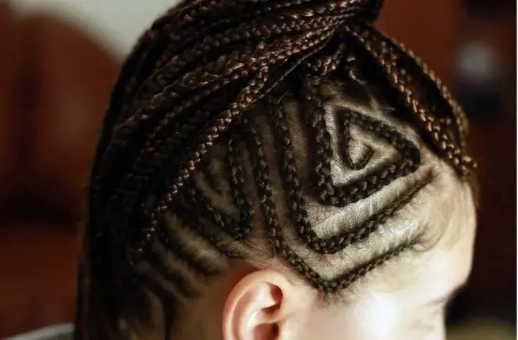 Woman wearing pyramid micro cornrows