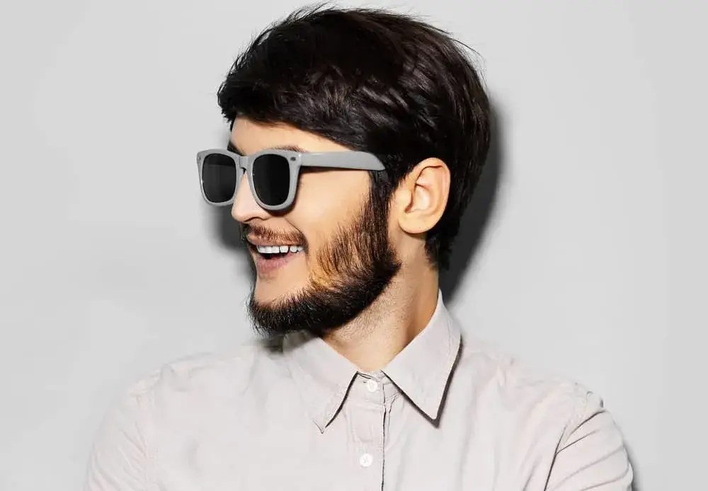 Man with glasses showing off his well-trimmed neckline