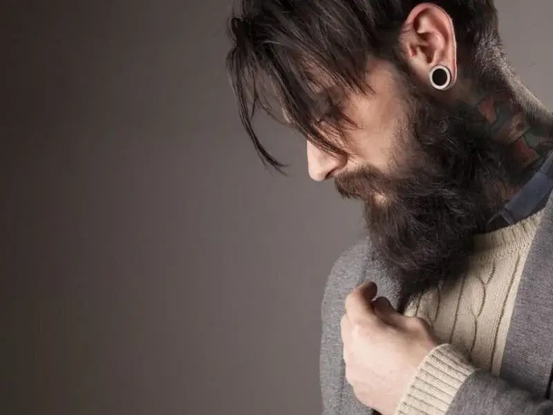 A sweaty man sporting a beard look.