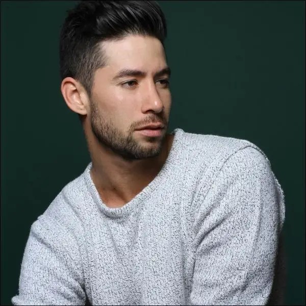 Handsome man rocking short neck beard.