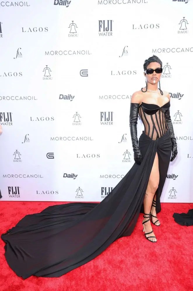 Teyana Taylor storms the red carpet in a black corset gown.