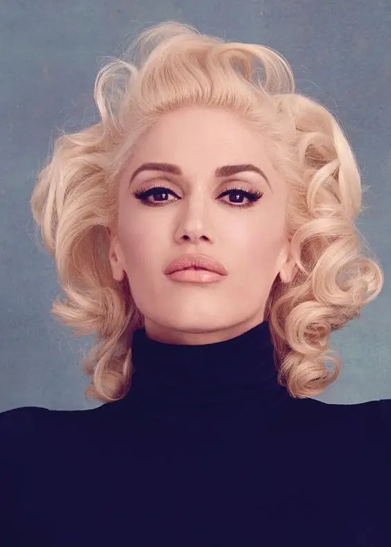 Gwen rocks a wavy look with gorgeous hair. Even in her 50s, Gwen is one hot blonde!