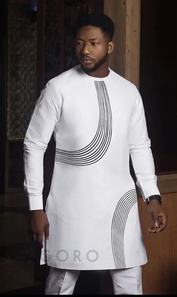 an actor wearing a white senator costume with stripes around it