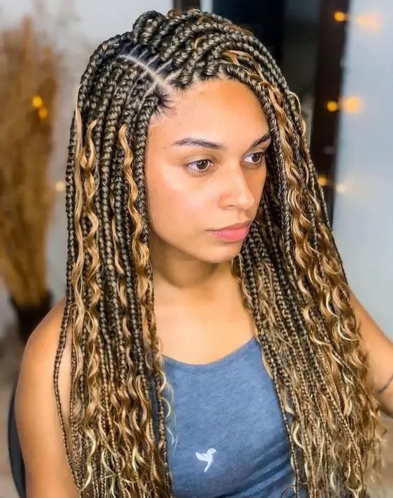 Pretty woman wearing side parted tribal braids