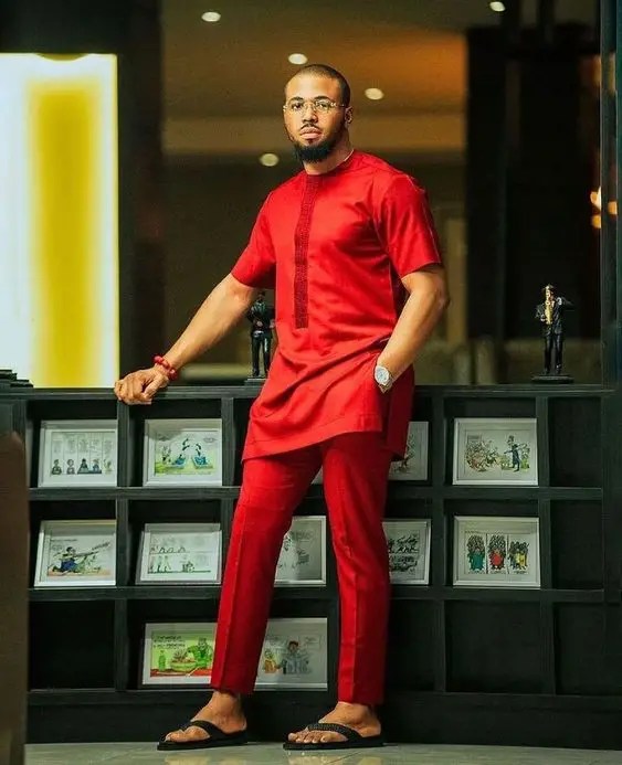 man in red senator costume
