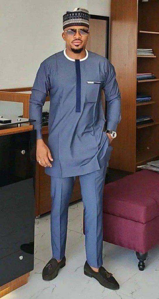 A man wearing a Hausa hat and rocking a caftan