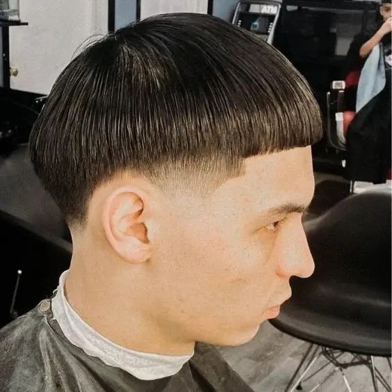 Man rocking Edgar haircut with fringe