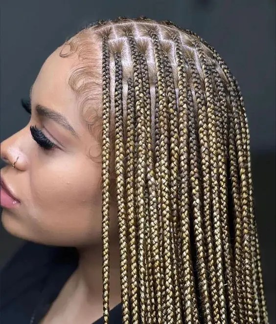 Profile of a woman rocking her blonde braids