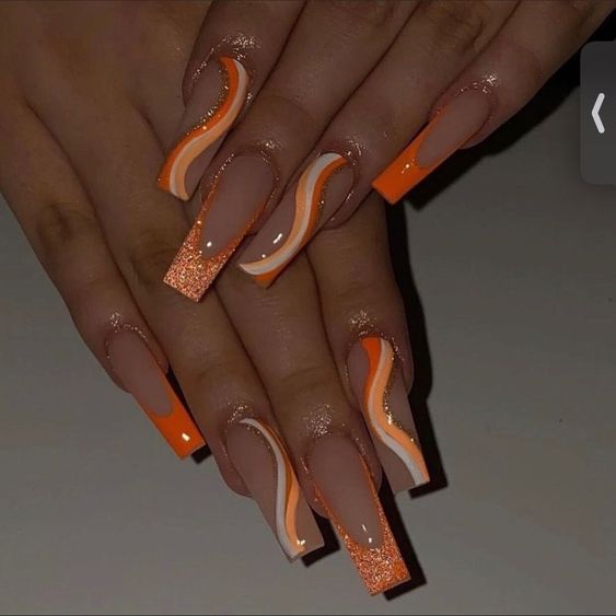 Nial Designs 2023: A beautiful set of nails with orange glitter tips