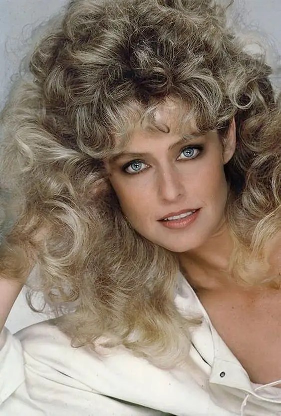 A beautiful blonde wavy blowout is one of the 80s hairstyles that classifies the era.