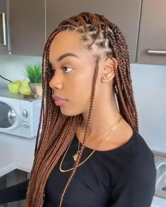 Side profile of a woman with side sweep braids