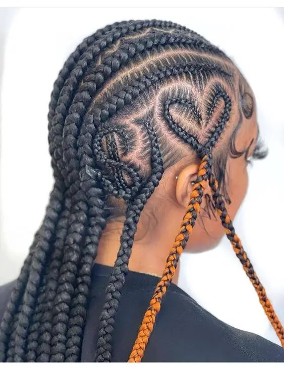 Woman with locking stitch braid in the shape of dollar sign and heart