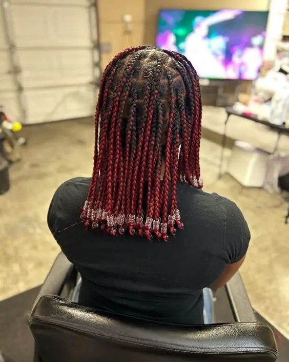 Pretty woman showing knotless braids with beads
