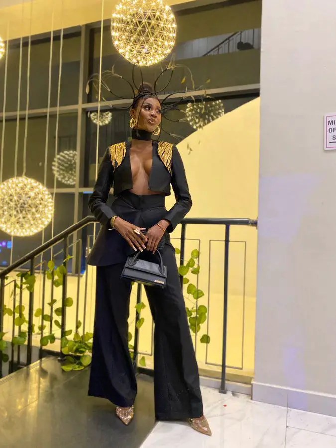 Beautiful amvca attendee in black suit with gold decoration