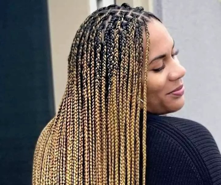 Women show off their braids with blonde extensions.