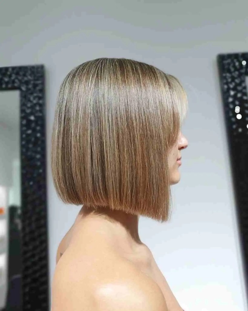 Profile with dirty blond hair and a bob cut.