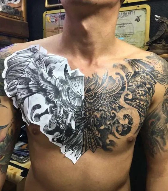 A man showing off his beautiful owl design on his sternum