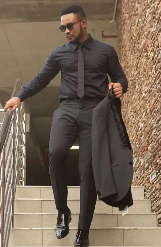 man wearing black suit
