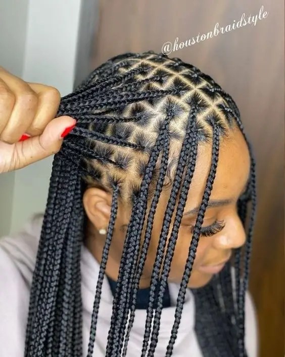 The women rock gorgeous little knotless braids with black extensions.