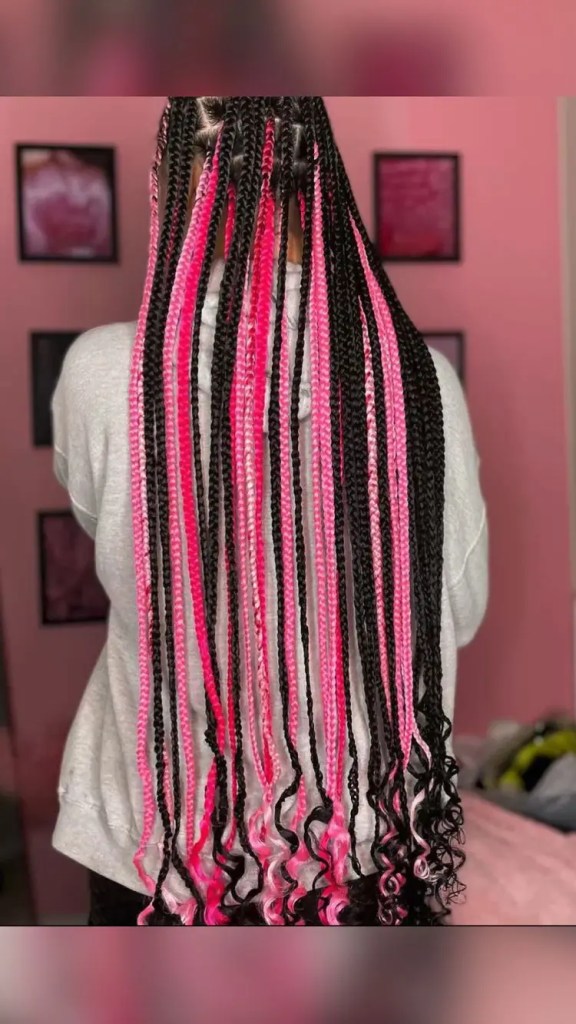 Back view of woman rocking black and pink braids
