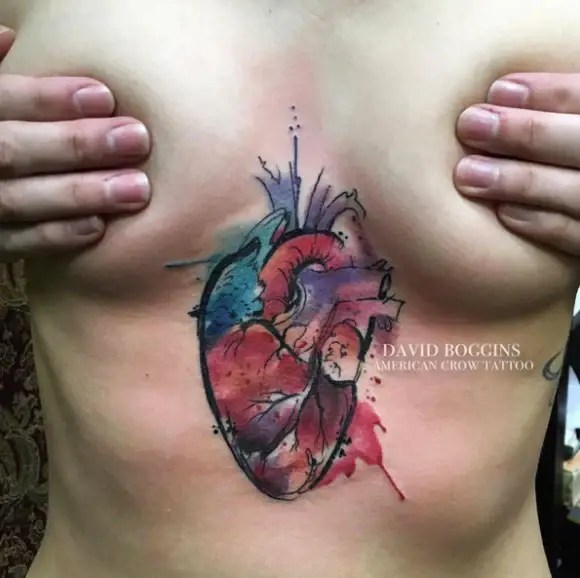 Beautiful sternum tattoo with watercolor effect.