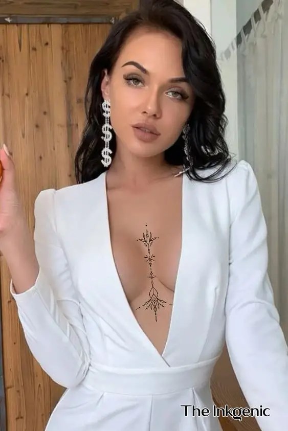 Beautiful woman showing off sternum tattoo while rocking white dress