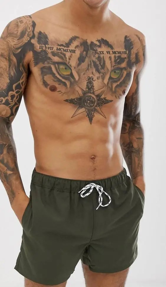 Man shows off sternum tattoo with star symbol