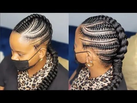 A woman wearing a face mask rocking a Mohawk braid