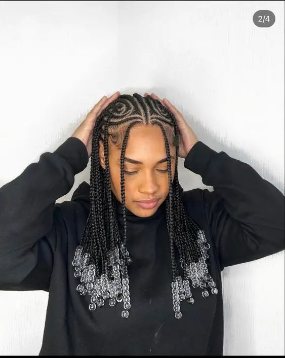 Girl doing hairstyle and showing off beaded hair
