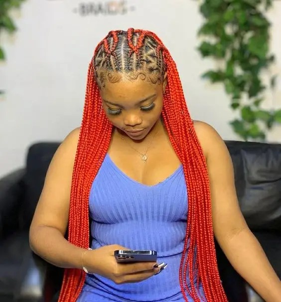 Woman rocking her orange stitched braid