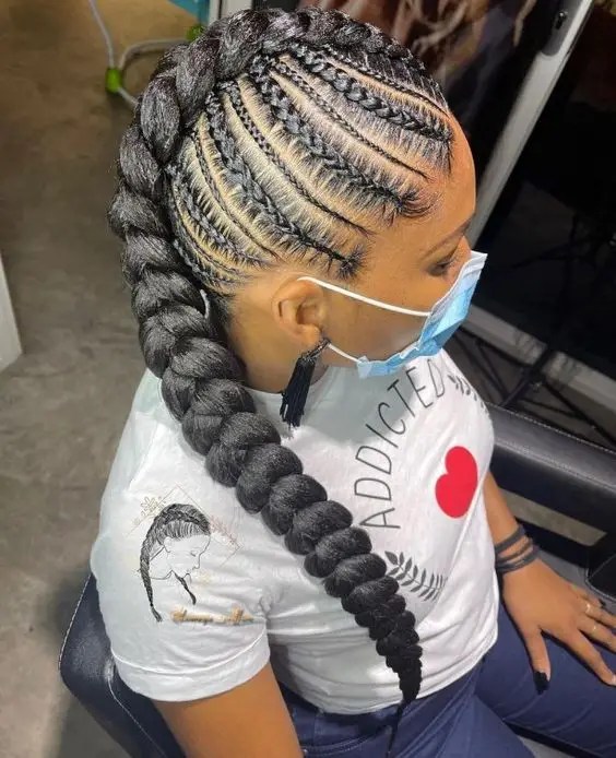 Woman rocking cornrows with micro and medium mohawk stitch