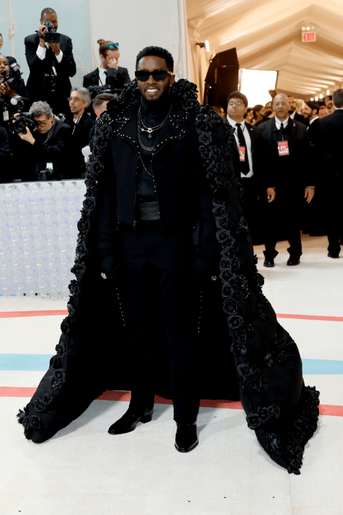 Sean Diddy looked fierce in a black puffer coat covered in black roses. Black shades to the Met Gala.