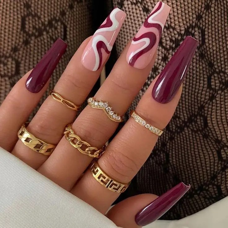 Nail design 2023: front view of an elegant hand with a ring