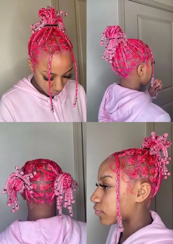Woman wearing pink curls and pink braids