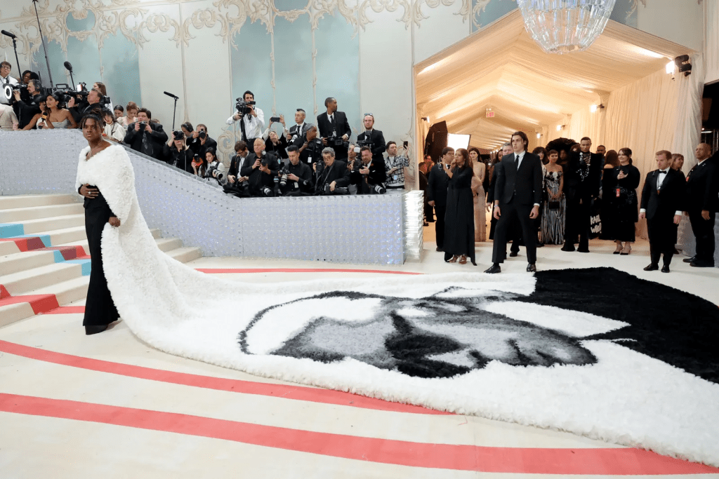 Jeremy Pope won the Met Gala theme with a stunning custom 30-foot cape from Balmain featuring a colossal image of Karl Lagerfeld.