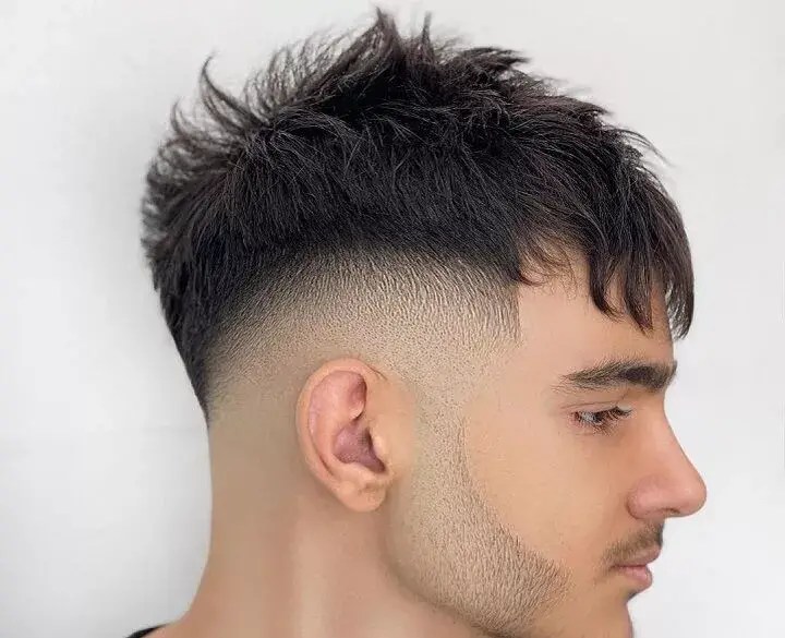 Pompadour style profile combined with mid fade haircut