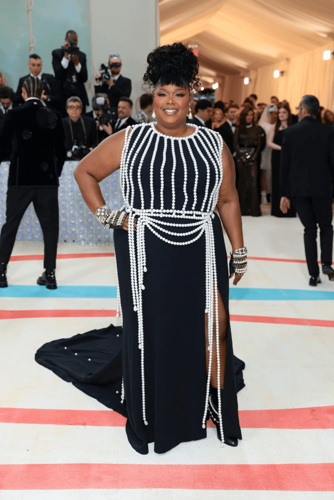 The singer stunned in a Chanel dress paired with Chanel accessories, shoes, purses and even Chanel makeup