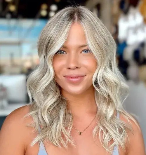 Beautiful woman rocking wavy icy blonde hair.