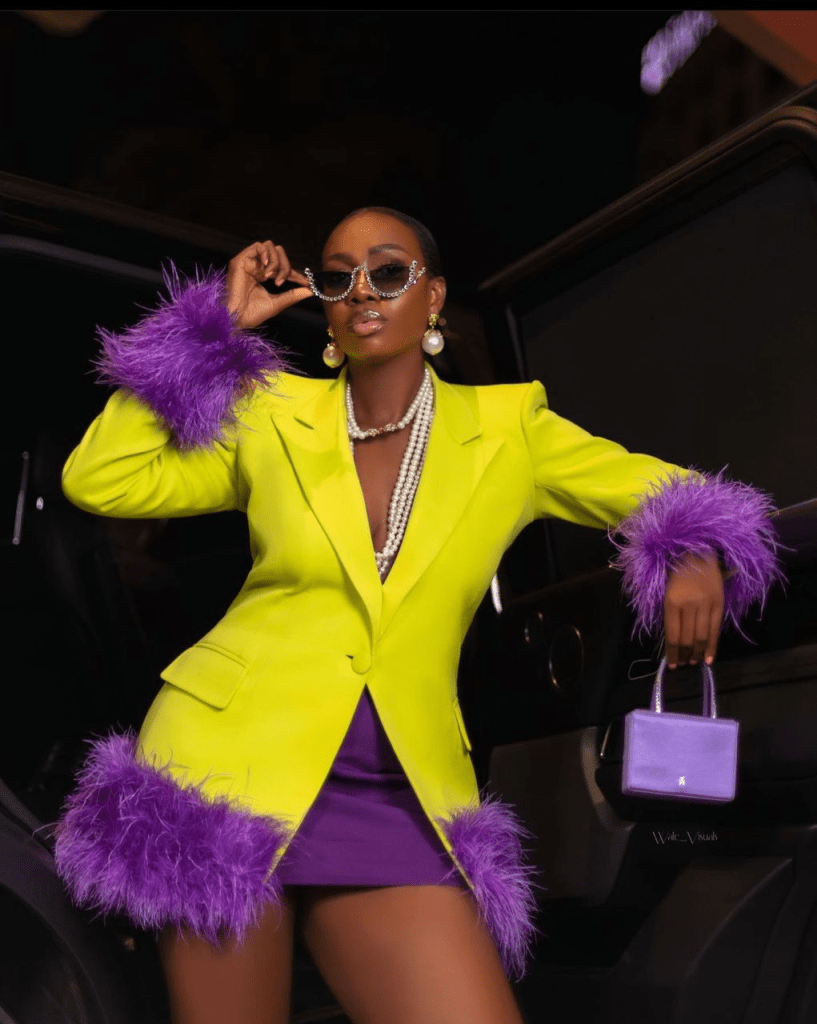 Medlin Boss in her yellow and purple two-piece suit