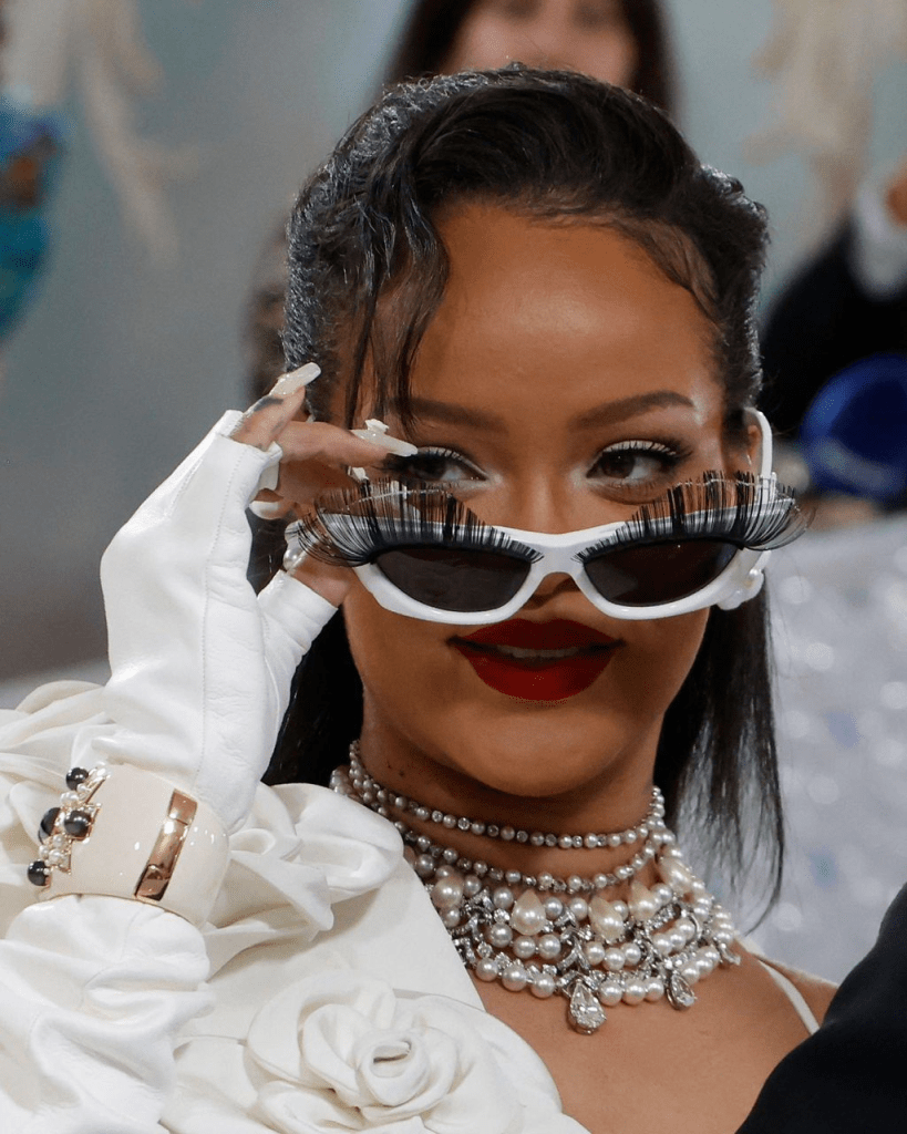 Close-up photo of Rihanna in sunglasses with eyelashes at the 2023 Met Gala