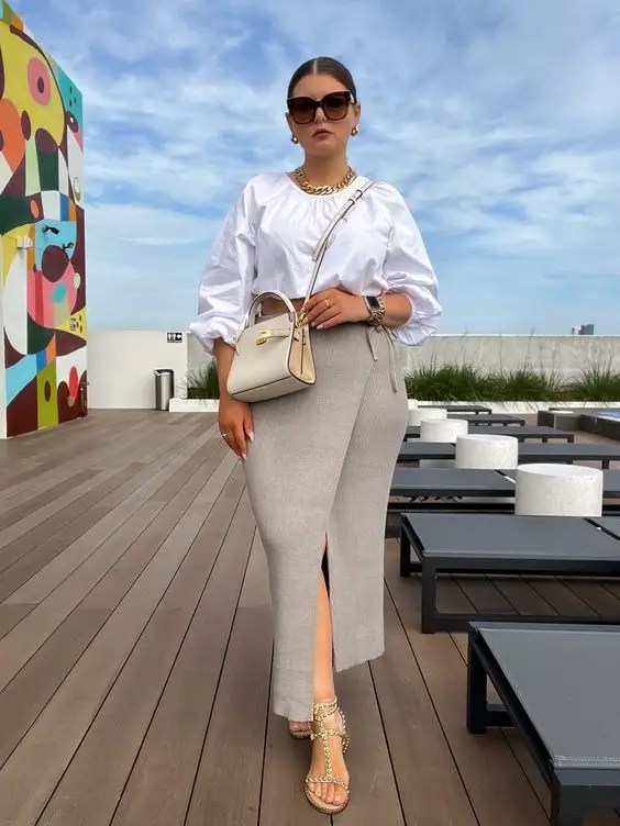 Caucasian woman rocking a midi dress with slits on her legs